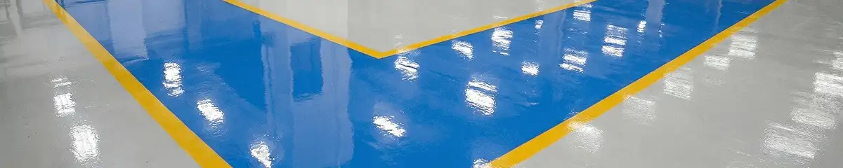 A factory floor professionally covered and marked with epoxy flooring in Jackson, MS