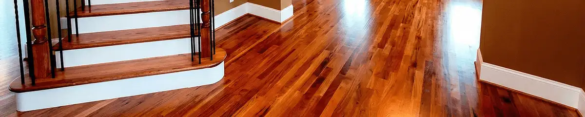 Base floor of a staircase with professionally restored wood flooring in Jackson MS