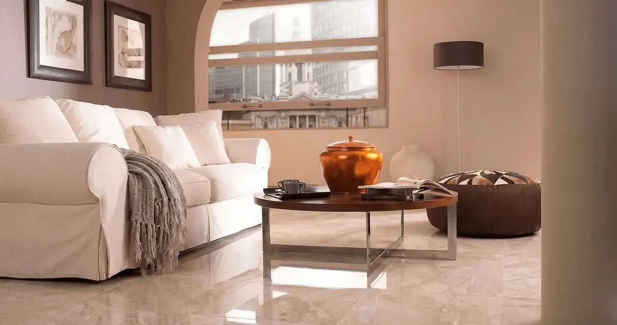 Modern living room with professionally installed marble flooring, a beige sofa, coffee table in Jackson, MS