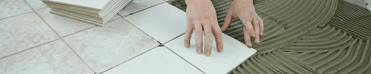 Professional installing white tile floors in Jackson, MS